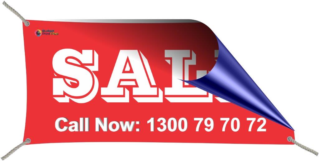 Single sided vinyl banner with red backgroung and white letters promoting a SALE